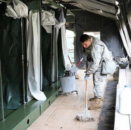 Even when you make it to the real Army, you'll still be mopping latrines. So, get used to it now. (Photo by Maj. Brandon Mace)