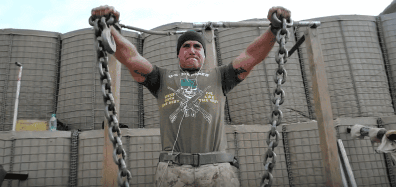 This Marine holds two heavy humvee chains to do a set of front raises during his deployment in Afghanistan. (Alex Green YouTube)