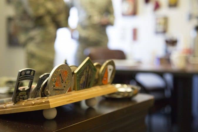 If they show off their challenge coin collection, it's not their ERB — thus proving they're an agent. (Photo by Spc. Tracy McKithern)