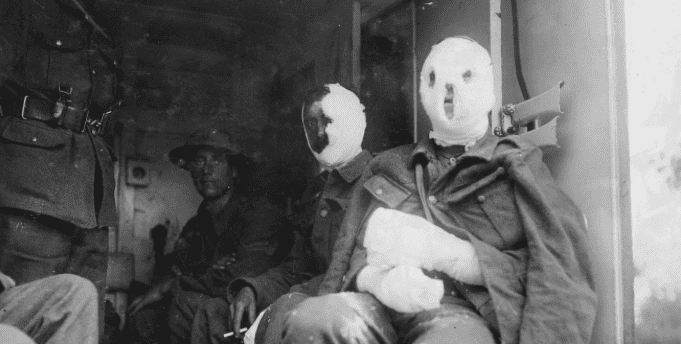 Mustard gas victims with bandaged faces await transport for treatment. (Canadian War Museum)