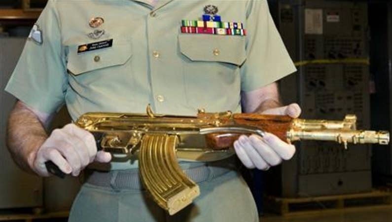 Saddam Hussein weapons plated with gold