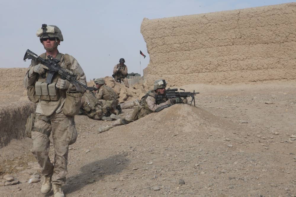 HM3 Mitchell Ingolia, assigned to 3rd Battalion, 5th Marine Regiment conducts a security patrol through the dangerous area known as Sangin, Afghanistan. (Photo by U.S. Marine Cpl. David Hernandez)