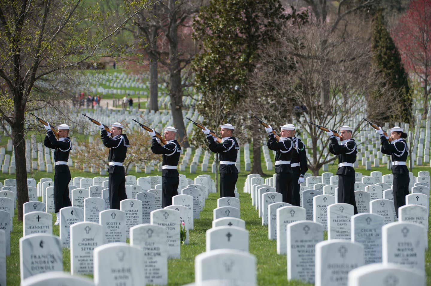 Sailors render a 21-gun salute for Capt. Thomas J. Hudner Jr. at Arlington National Cemetery during Hudner's funeral.