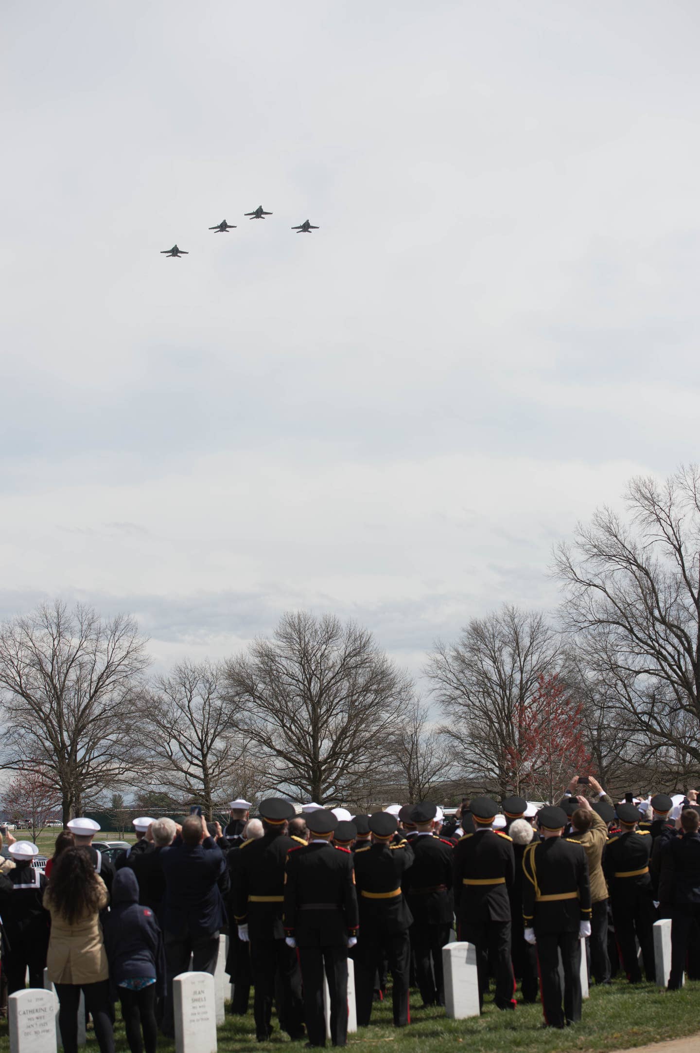 Four F/A-18 Super Hornets flyover the funeral of Capt. Thomas J. Hudner Jr.