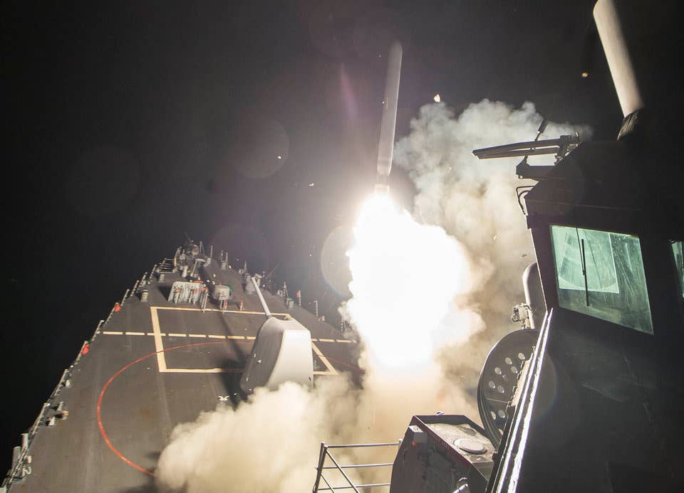 U.S. Navy guided-missile destroyer USS Ross (DDG 71) fires a tomahawk land attack missile in Mediterranean Sea which U.S. Defense Department said was a part of cruise missile strike against Syria.