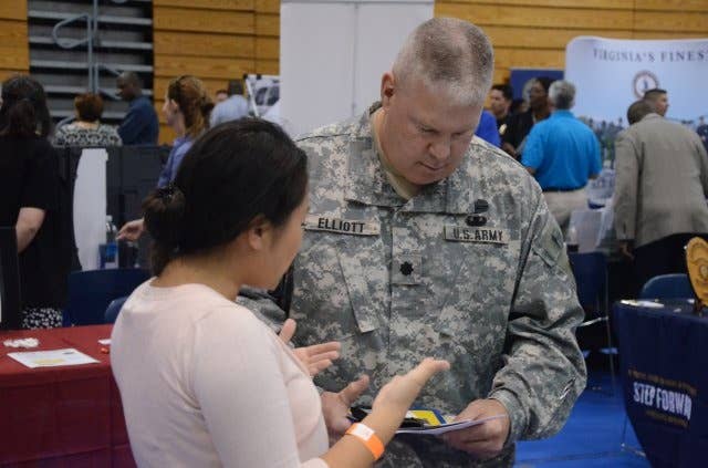 Lt. Col. Donald Elliott, of the Adjutant General School, talks to a representative from Penske. Elliott is retiring in a year and wants to start preparing for his transition into civilian life.