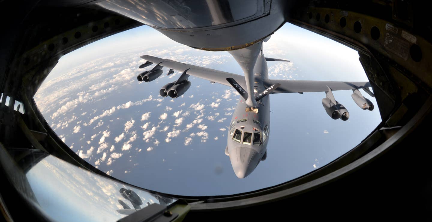 A B-52 Stratofortress from Barksdale Air Force Base, La., takes fuel from a KC-135 Stratotanker assigned to the 100th Air Refueling Wing at RAF Mildenhall, England, Sept. 18, 2015, in the skies near Spain. The refueling was part of exercise Immediate Response, which included a three-ship formation o