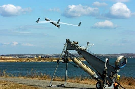 A Scan Eagle unmanned aerial vehicle launches from the Potomac River Test Range.