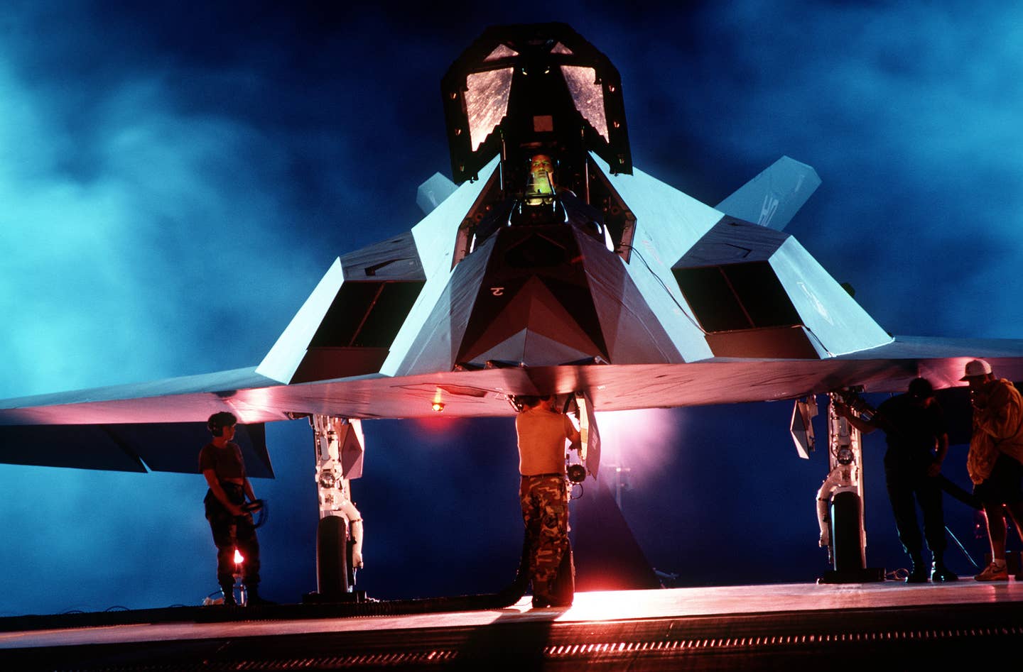 A back lit front view of an F-117 Nighthawk.