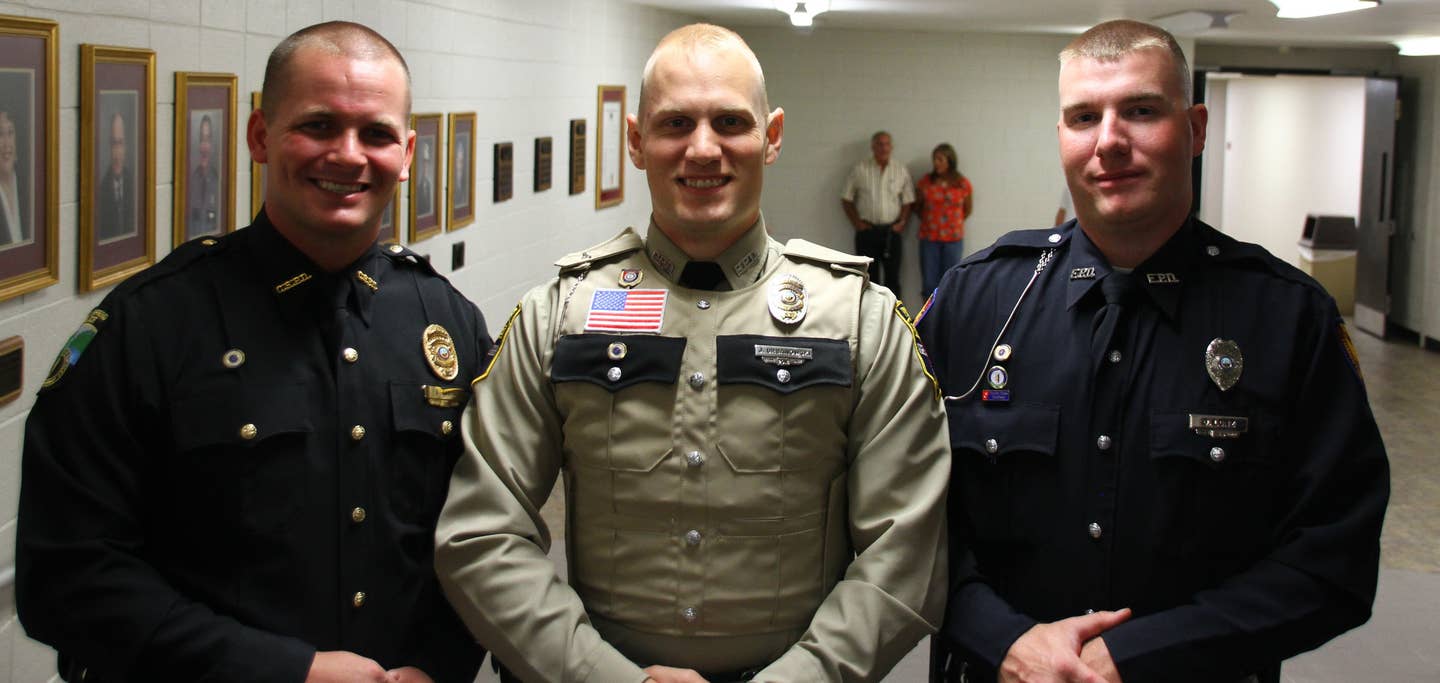 Three Guardsmen graduate from the Kentucky Department of Criminal Justice Basic Training academy for law enforcement officers in Richmond, Ky, 2017.<br>(Kentucky National Guard photo by Stacy Floden)