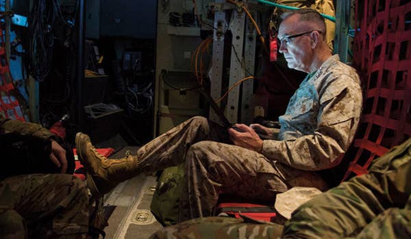 Gen. Joseph Dunford Jr. works aboard a C-130 aircraft at Bagram Airfield before a visit to Task Forceu2013Southwest at Camp Shorab, Helmand Province, March 22, 2018.
