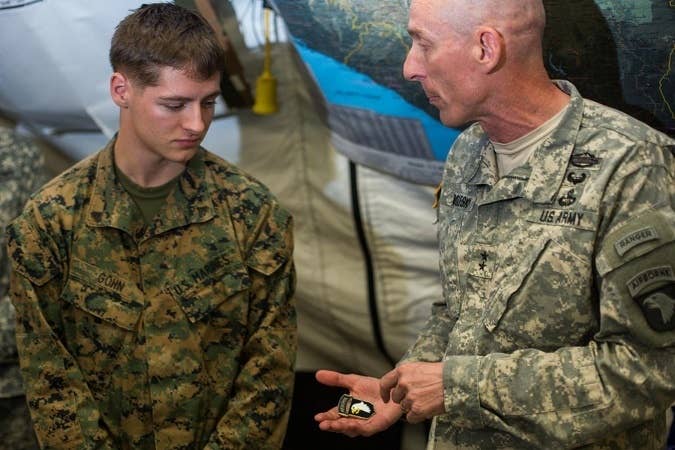Being a soldier in the 101st and receiving a coin from the commanding general is great. Being a Marine and receiving one from him is far more impressive.