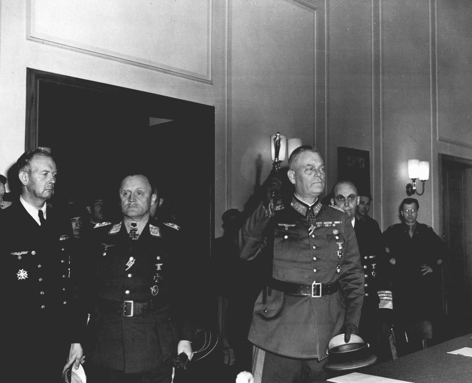 Three senior German officials emerge after Germany's unconditional surrender terms were formally ratified in Berlin, May 9, 1945.