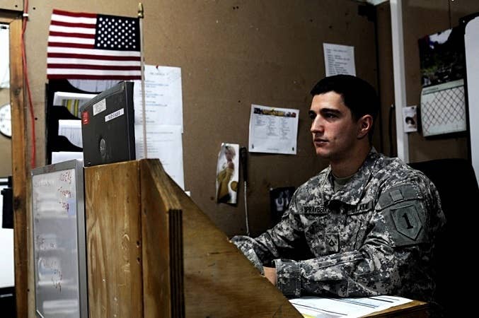 A soldier with a low rank doing paperwork