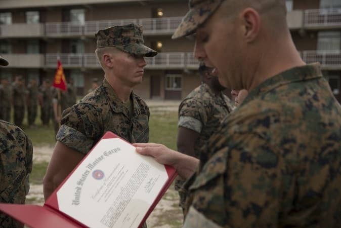 A soldier getting a new Marine Corps rank