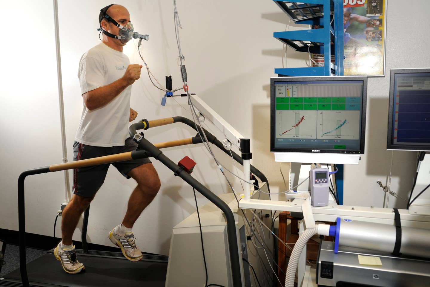 Capt. Dustin Benker runs on a treadmill at the U.S. Air Force Academy's Human Performance Laboratory to check his oxygen and carbon dioxide levels while he works out. <small>(U.S. Air Force photo by J. Rachel Spencer)</small>