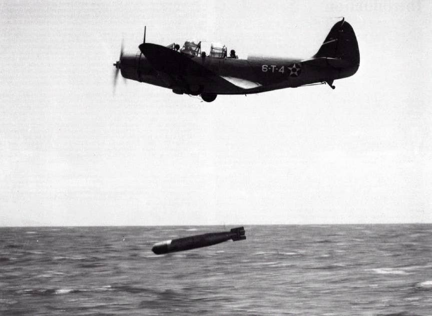 A Douglas TBD Devastator drops a Mk 13 aerial torpedo just prior to World War II. The two American carriers at the Coral Sea had 25 of these planes.<br>(U.S. Navy)<br> 