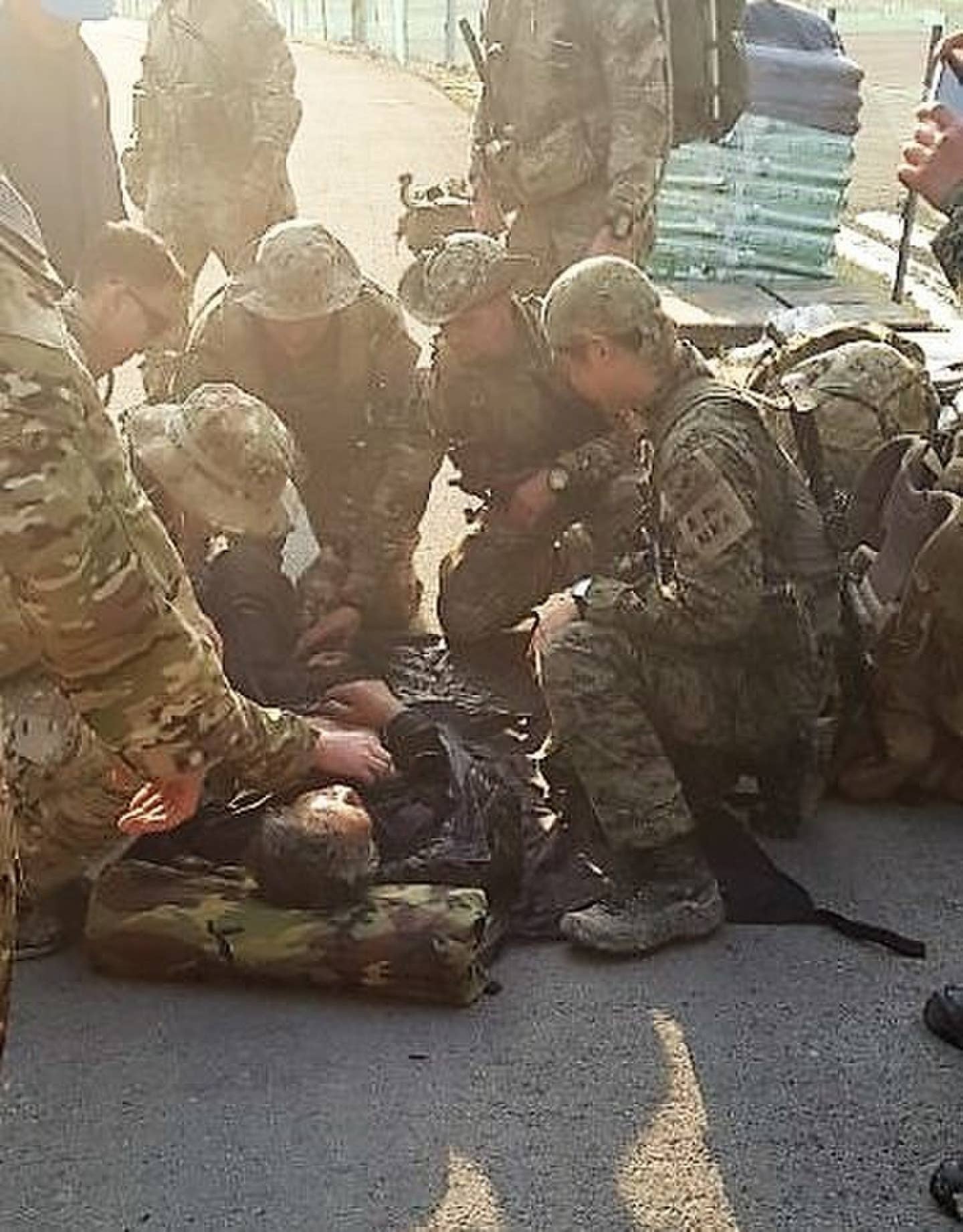 Soldiers from the 1st Special Forces Group (Airborne) and the Republic of Korea Special Forces provide lifesaving emergency care to a Korean farmer.