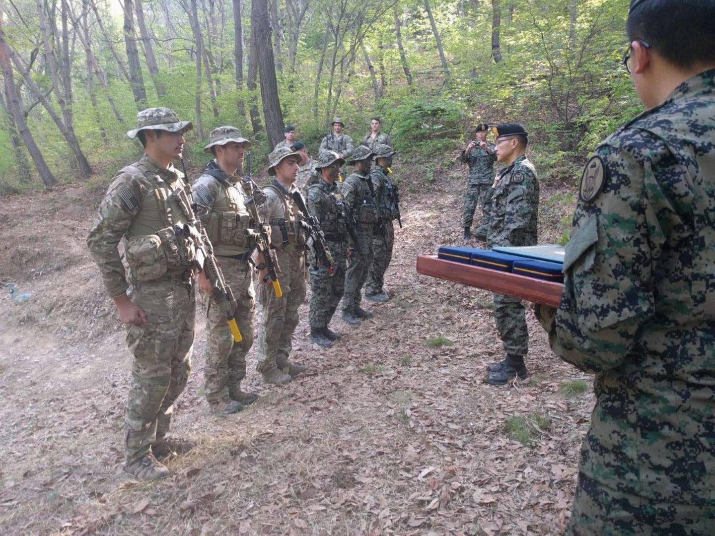 Soldiers from the 1st Special Forces Group (Airborne) and the Republic of Korea Special Forces receive recognition from the Republic of Korea Special Warfare for their lifesaving actions.
