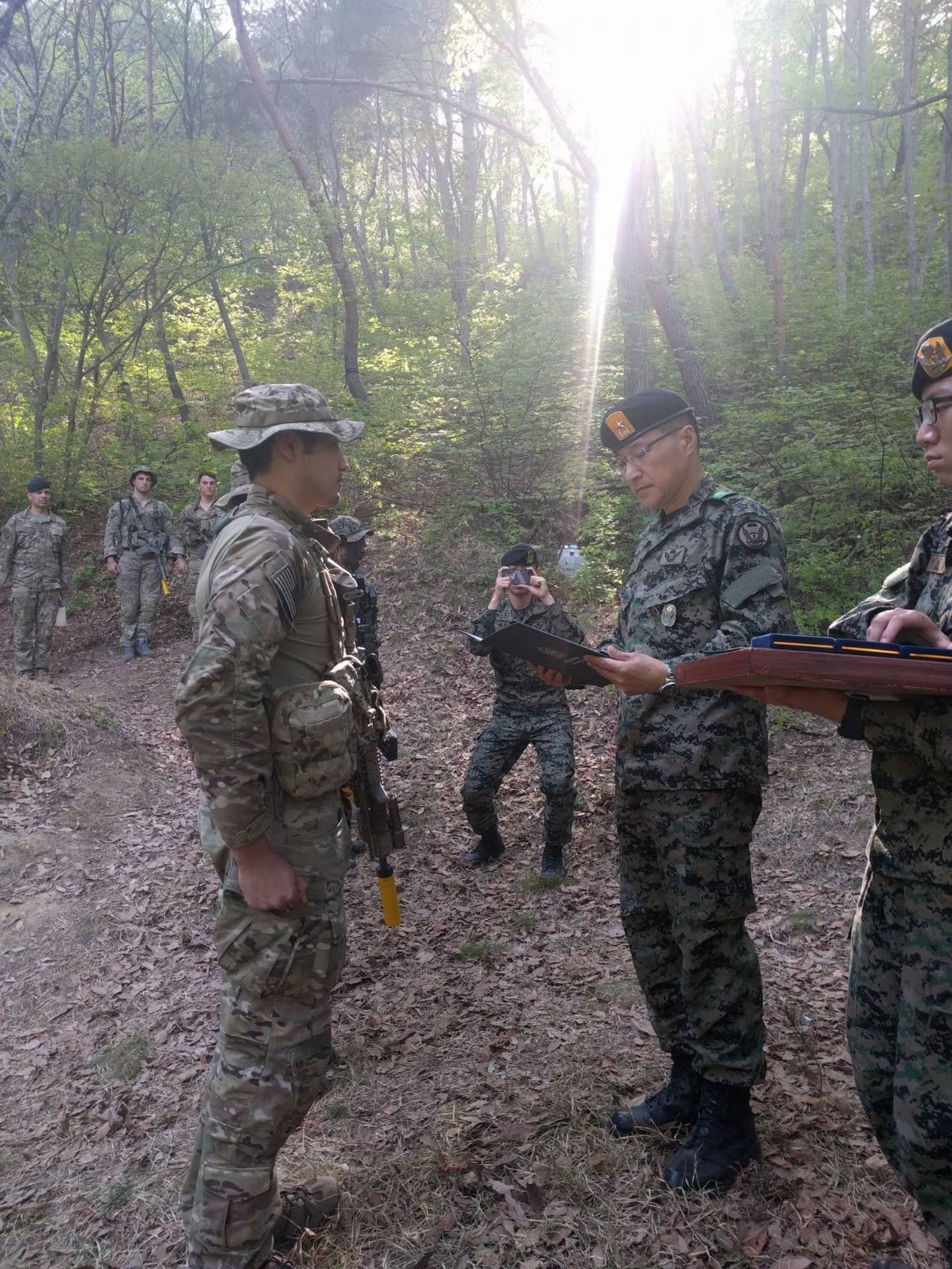 A Republic of Korea Special Warfare Command general presents citations to Soldiers