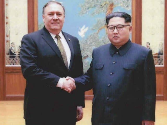 Then-CIA director Mike Pompeo and North Korean leader Kim Jong Un.
