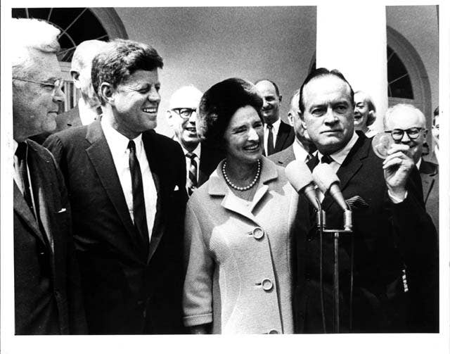 Bob Hope receives the Congressional Gold Medal from President Kennedy.<br>(Library of Congress)