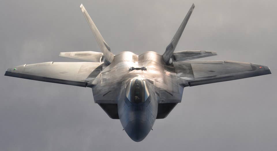 A US Air Force F-22 Raptor fighter aircraft over Alaska after refueling January 5, 2013.