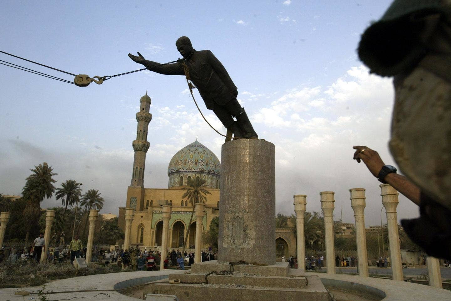 The April 2003 toppling of Saddam Hussein's statue in Firdos Square in in Baghdad shortly after the Iraq Waru00a0invasion.