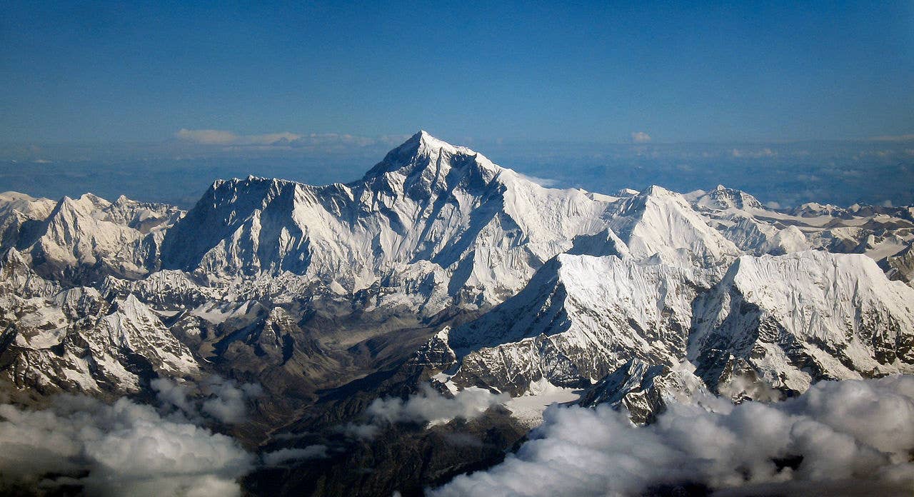 Aerial photo from the south, with Mount Everest rising above the ridge connecting Nuptse and Lhotse.