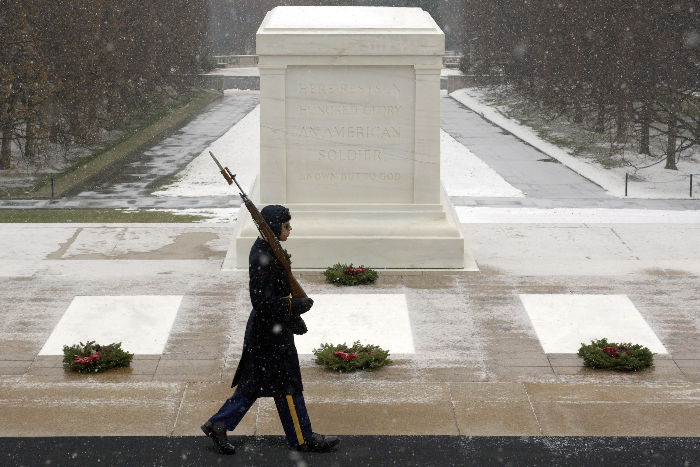 The Sentinel Guardsman never leaves their post at the Tomb of the Unknown Soldier. A sentinel paces in snow.