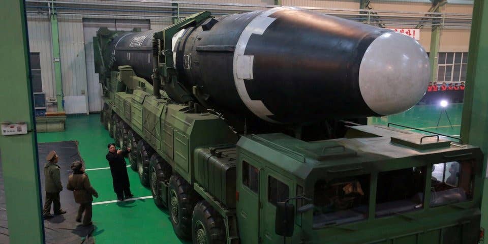 Kim with a North Korean intercontinental ballistic missile.