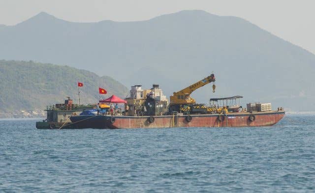 A floating barge where Army and Navy divers worked from as they searched for the remains of Soldiers lost in a Chinook helicopter crash during the Vietnam War near Nha Trang, Vietnam, March 19, 2018.