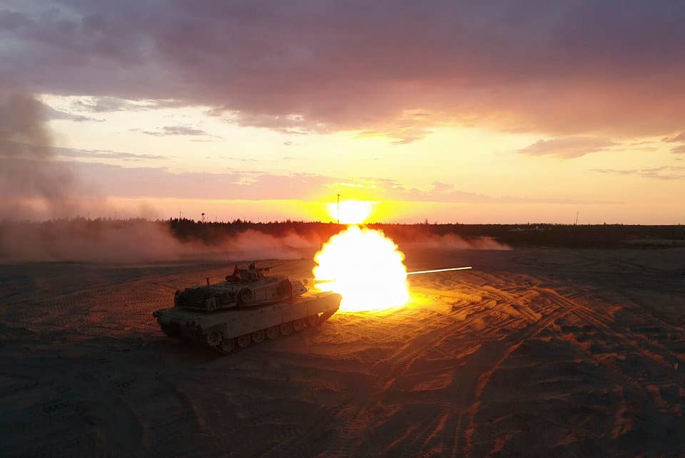 Marines with Bravo Company, 4th Tanks Battalion, fire a M1A1 Abrams tank during a low-light live-fire exercise as part of Exercise Arrow 18 in Pohjankangas Training Area near Kankaanpaa, Finland, May 16, 2018.