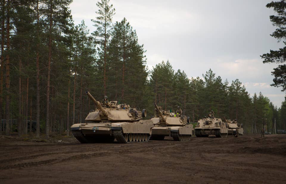 Marines with Bravo Company, 4th Tanks Battalion, prepare their M1A1 Abrams tanks for a live-fire exercise as part of Exercise Arrow 18 in Pohjankangas Training Area near Kanakaanpaa, Finland, May 16, 2018.