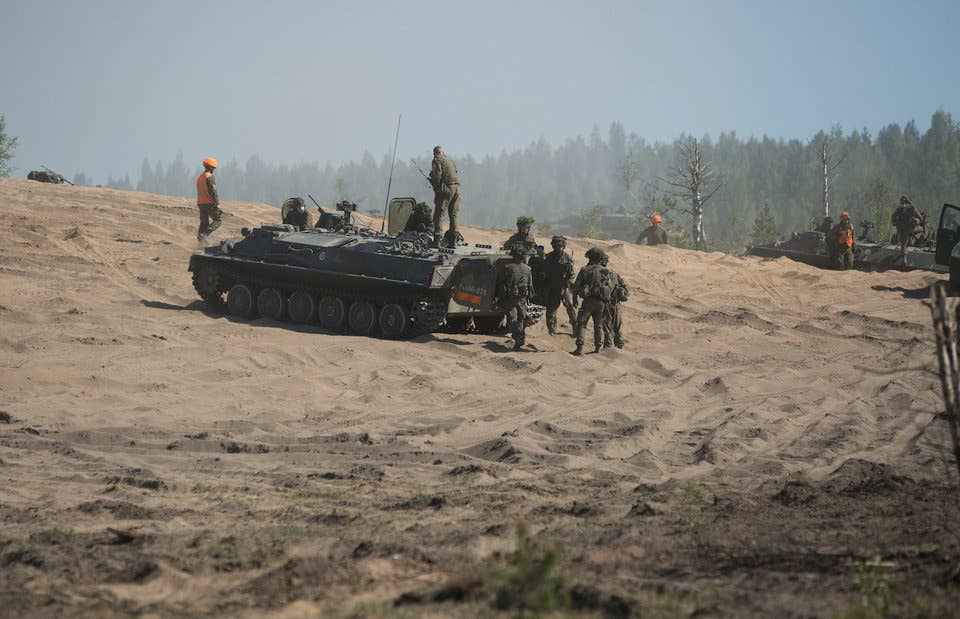 Finnish soldiers stage Leopard tanks during a live-fire exercise as part of Exercise Arrow 18 in Pohjankangas Training Area near Kankaanpaa, Finland, May 18, 2018.