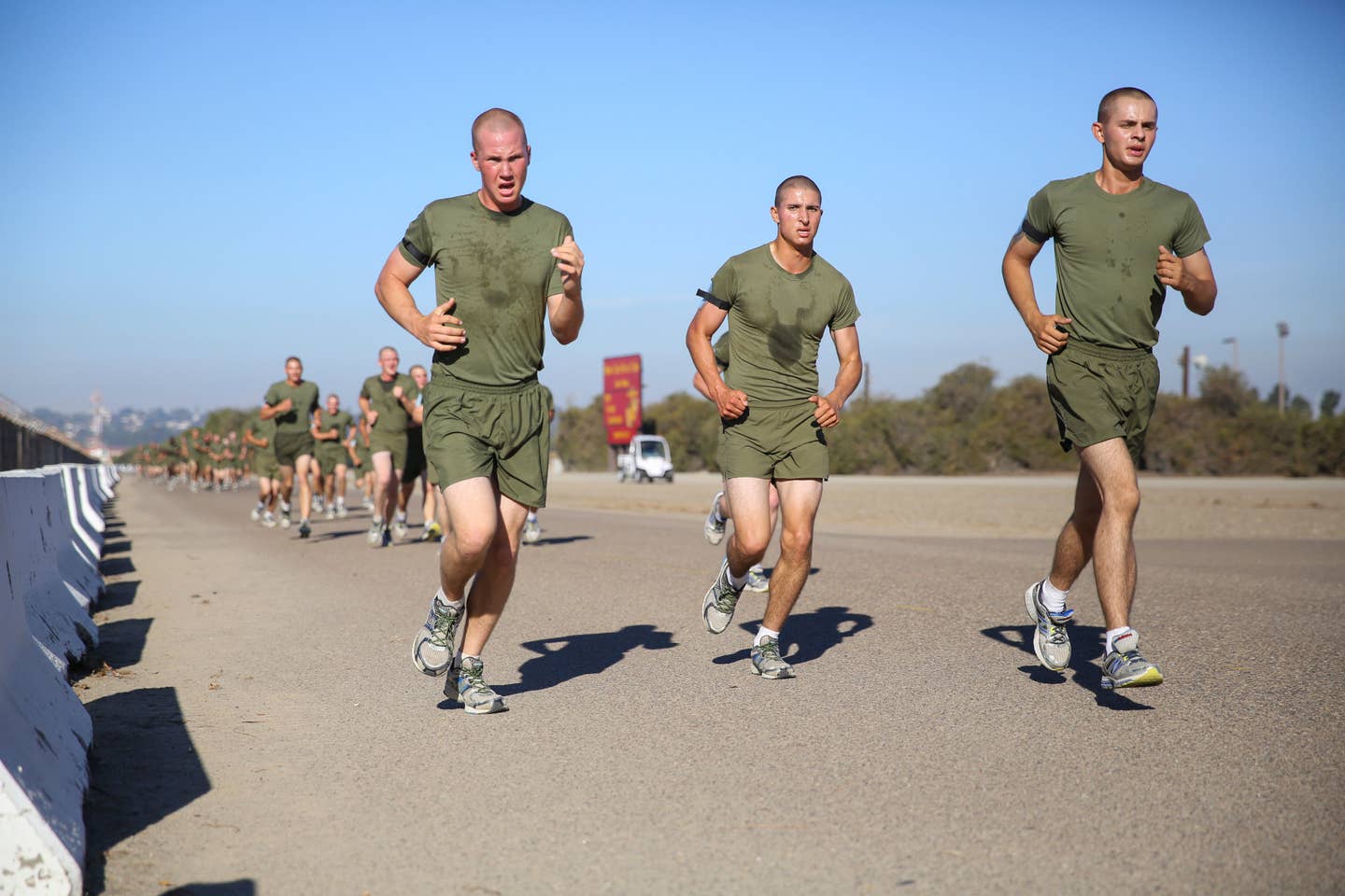 Recruits of India Company, 3rd Recruit Training Battalion, push forward during the three-mile run portion of their Physical Fitness Test aboard Marine Corps Recruit Depot San Diego, Calif.<br>(Photo by Marine Sgt. Benjamin E. Woodle)<br> 