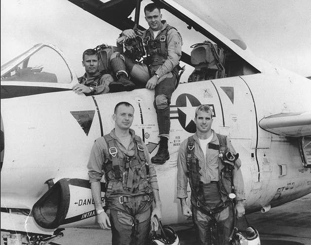 McCain (front right) with his squadron and T-2 Buckeye trainer, 1965