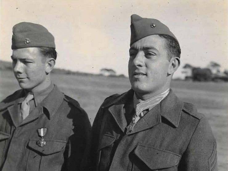 Basilone, right, wearing his Medal of Honor.