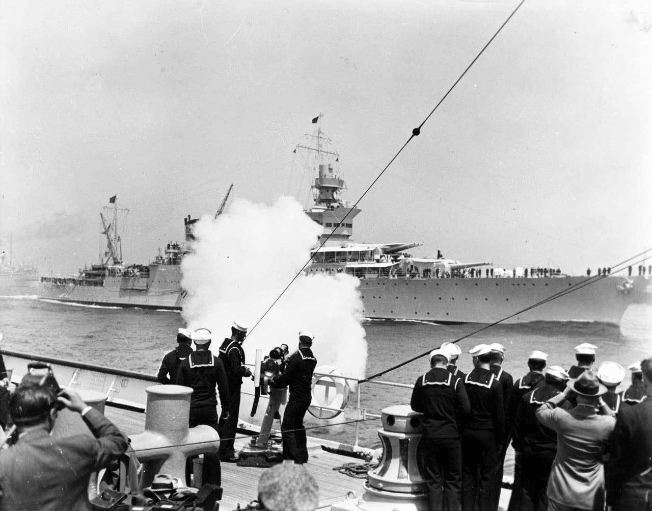President Franklin D. Roosevelt, embarked on Indianapolis, receives a 21-gun salute from <a href="https://en.wikipedia.org/wiki/USCGC_Mojave_(WPG-47)" target="_blank" rel="noreferrer noopener">Coast Guard Cutter Mojave</a>, during the presidential fleet, 1934.