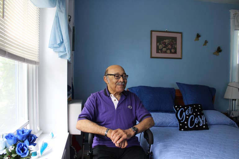 Ralph Stepney, a Vietnam War veteran who was homeless a decade ago, watches TV in his room.