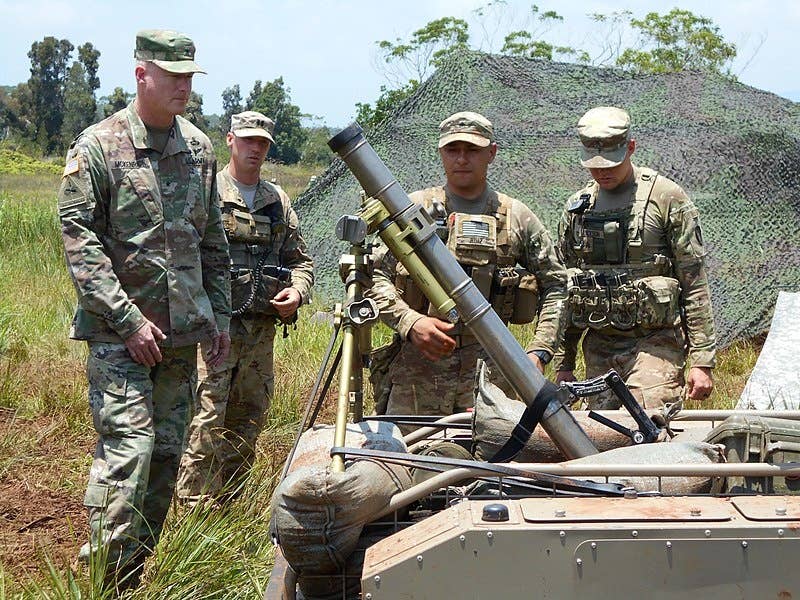 Soldiers of the 25th Infantry Division explain the capabilities of the multipurpose unmanned tactical transport.