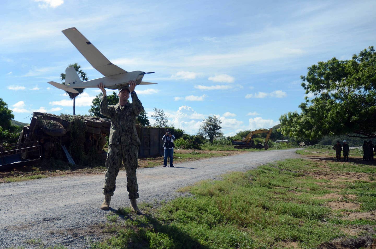 Electronics Technician 2nd Class Peter Romines launches the unmanned aircraft system drone.