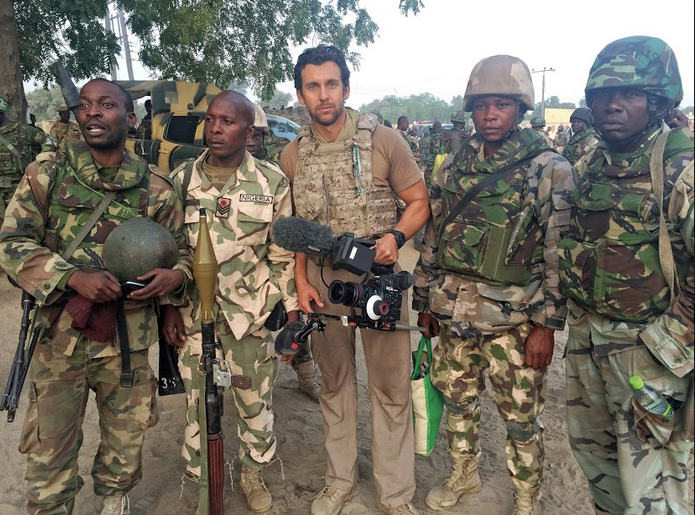 Larsen with Nigerian troops while covering the fight against Boko Haram for Vice News.