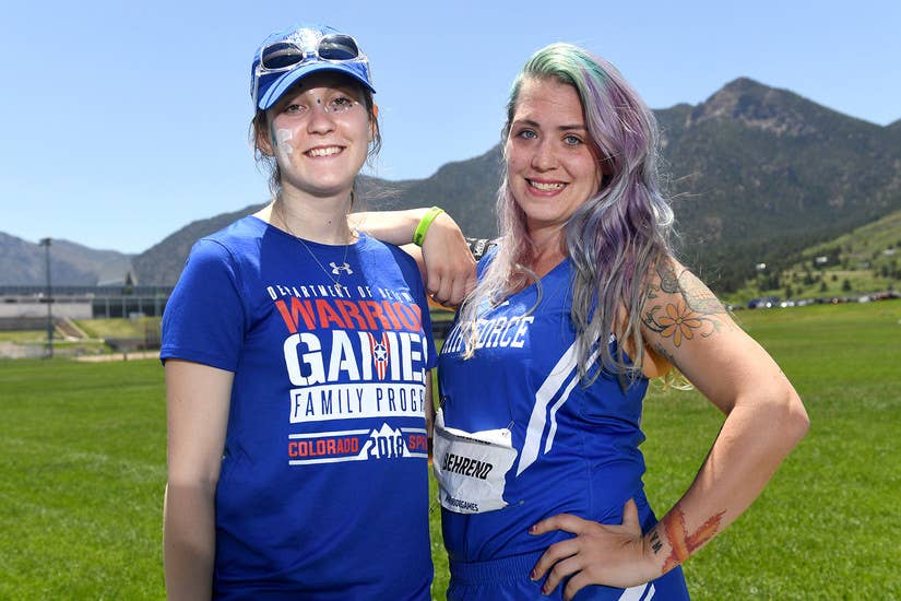 Medically retired Air Force Senior Airman Karah Behrend, right, and her sister Crystal Boyd pose for a photo at the 2018 Defense Department Warrior Games at the U.S. Air Force Academy in Colorado Springs, Colo., June 2, 2018.