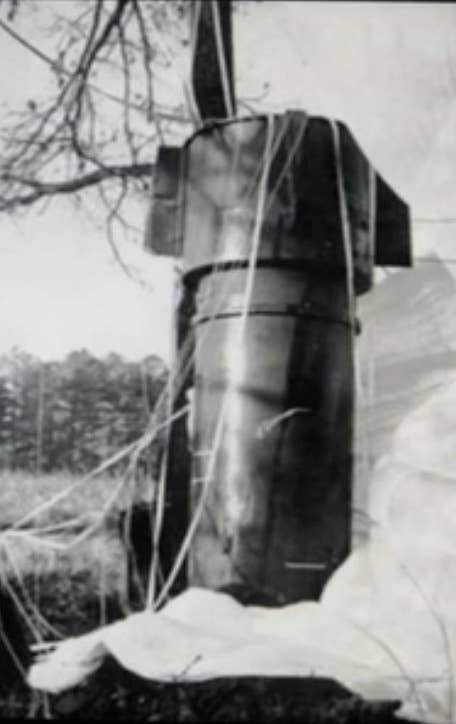 Close up of one of two Mark 39 thermonuclear bombs in a North Carolina field after falling from a disintegrating B-52 bomber in an incident known as the "<a href="https://en.wikipedia.org/wiki/1961_Goldsboro_B-52_crash" target="_blank" rel="noreferrer noopener">1961 Goldsboro B-52 crash</a>."<br>(Photo by U.S. Air Force)