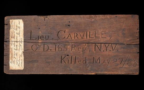 The grave marker of Lt. Charles R. Carville, a member of the 165th New York Volunteers who died at Port Hudson May 27, 1863. <small>(Nation Museum of American History)</small>