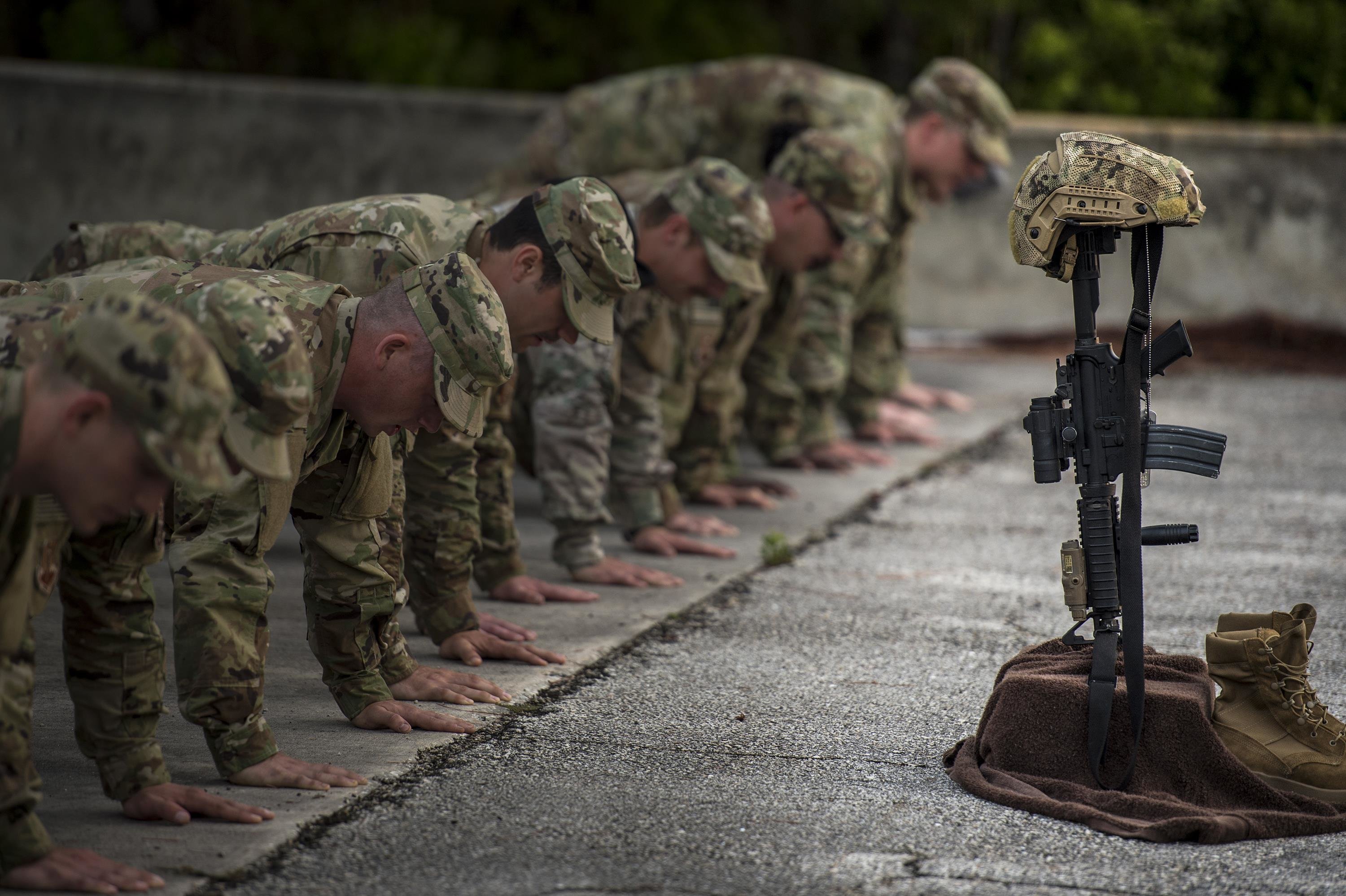 A battlefield cross sits on display during sunrise, April 15, 2016, at Avon Park Air Force Range, Fla. U.S. Air Force Airmen from the 93d Air Ground Operations Wing set up the cross for Lt. Col. William Schroeder. <small>(Photo by Senior Airman Ryan Callaghan)</small>
