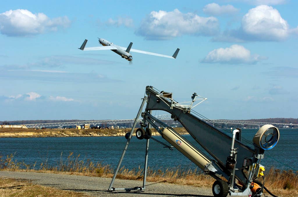A Scan Eagle unmanned aerial vehicle launches from the Navy Surface Warfare Centeru00a0Dahlgren test range.