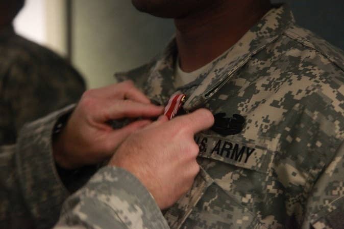 Hey, 10 points are 10 points. Promotion is hard for an MOS that requires as many as 798 in a given month. <small>(Photo by Pvt. Paul R. Watts Jr.)</small>