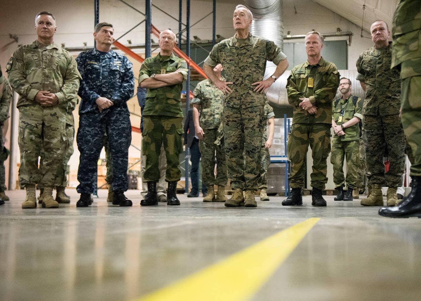 Marine Corps Gen. Joseph F. Dunford Jr., chairman of the Joint Chiefs of Staff, and Admiral Haakon Bruun-Hanssen, Norwegian Chief of Defence, tour the Marine Corps Prepositioning Program-Norway in the Frigaard Cave, Sept. 20, 2017.